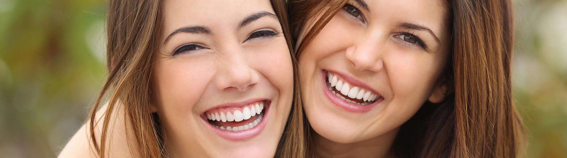 Two happy women with perfect smiles Marietta GA